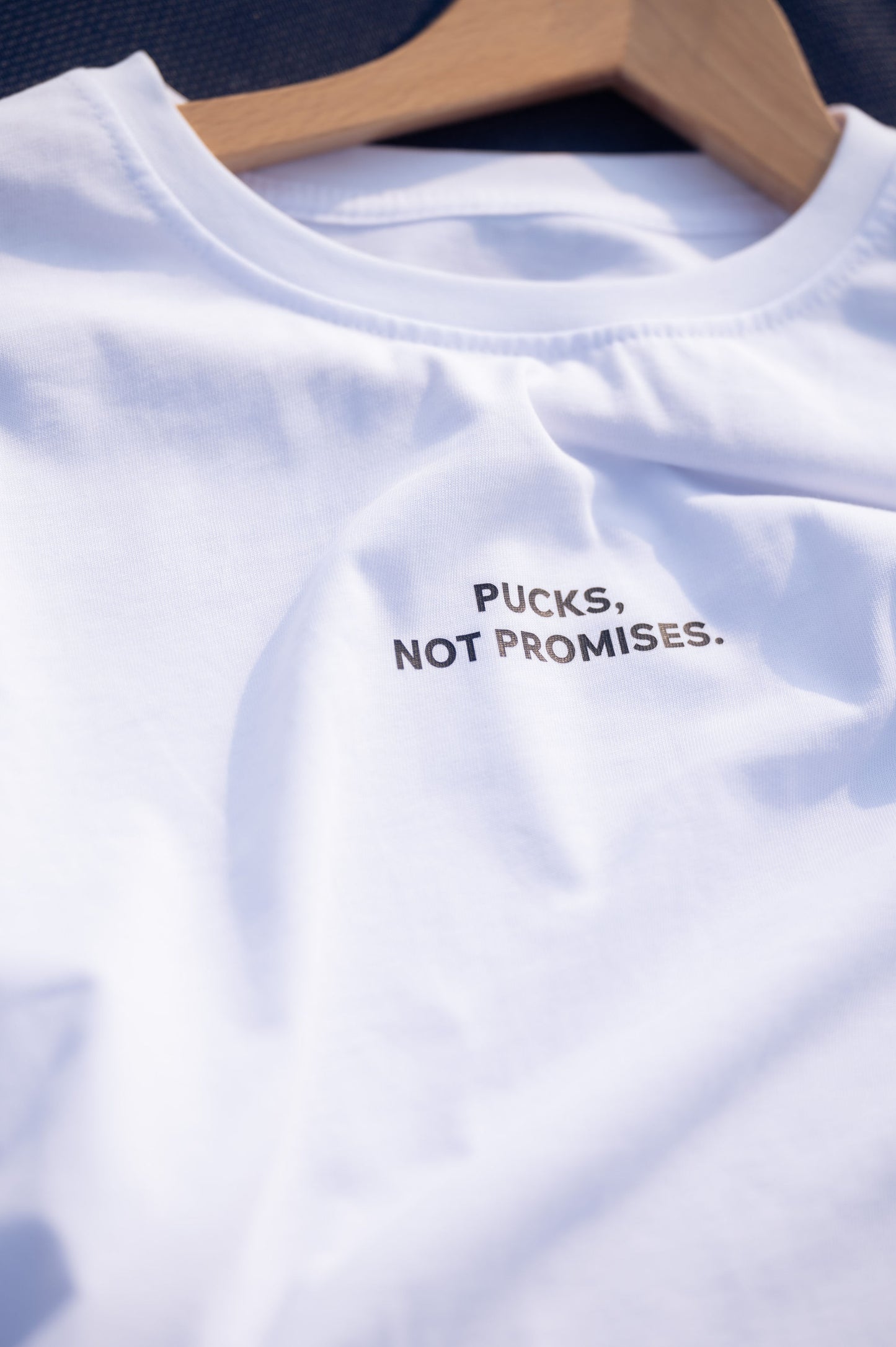 Білий лонгслів “Pucks, Not Promises”
